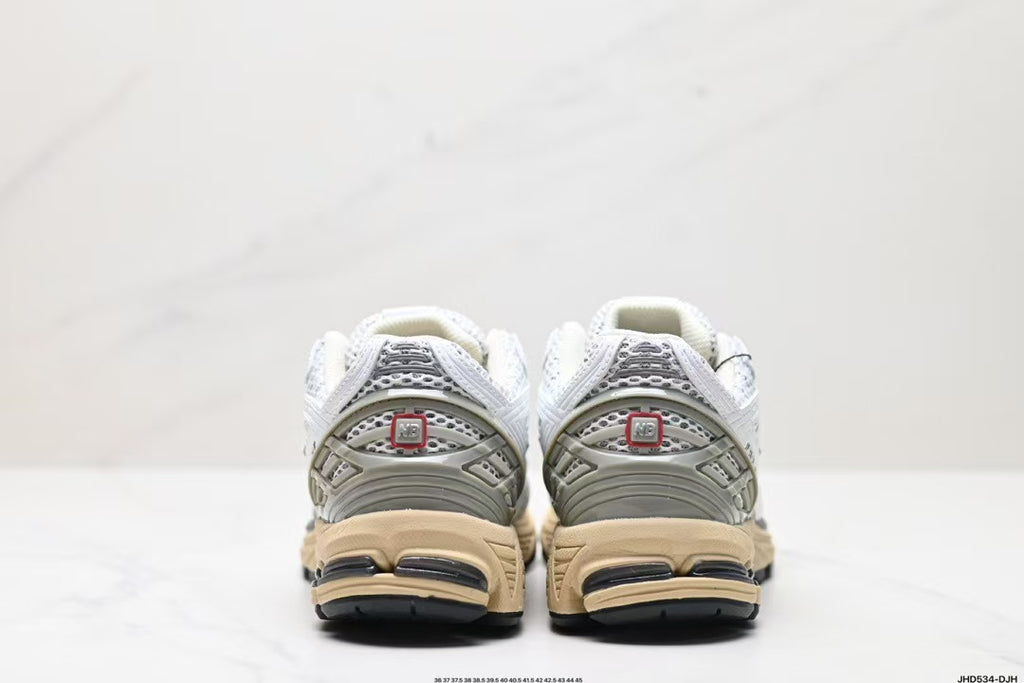 Tenis New Balance 1906 Blanco Gris.