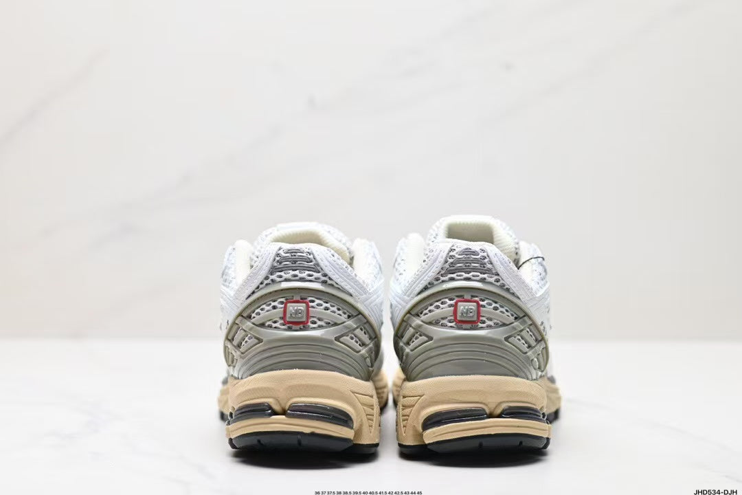 Tenis New Balance 1906 Blanco Gris.