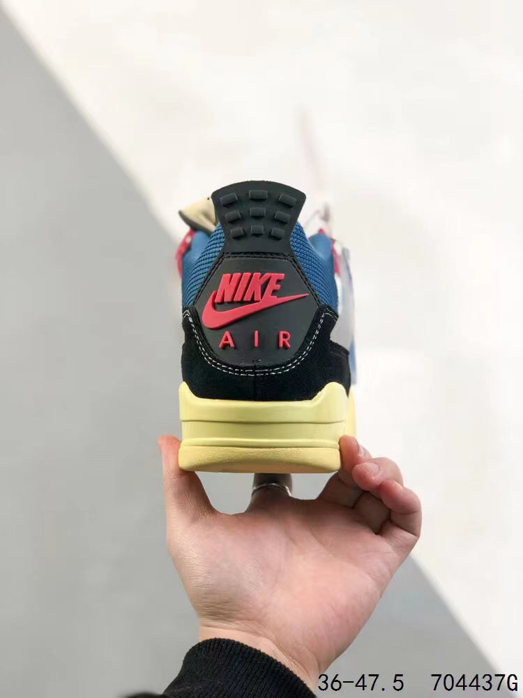Tenis Jordan 4 Retro Negro Azul.