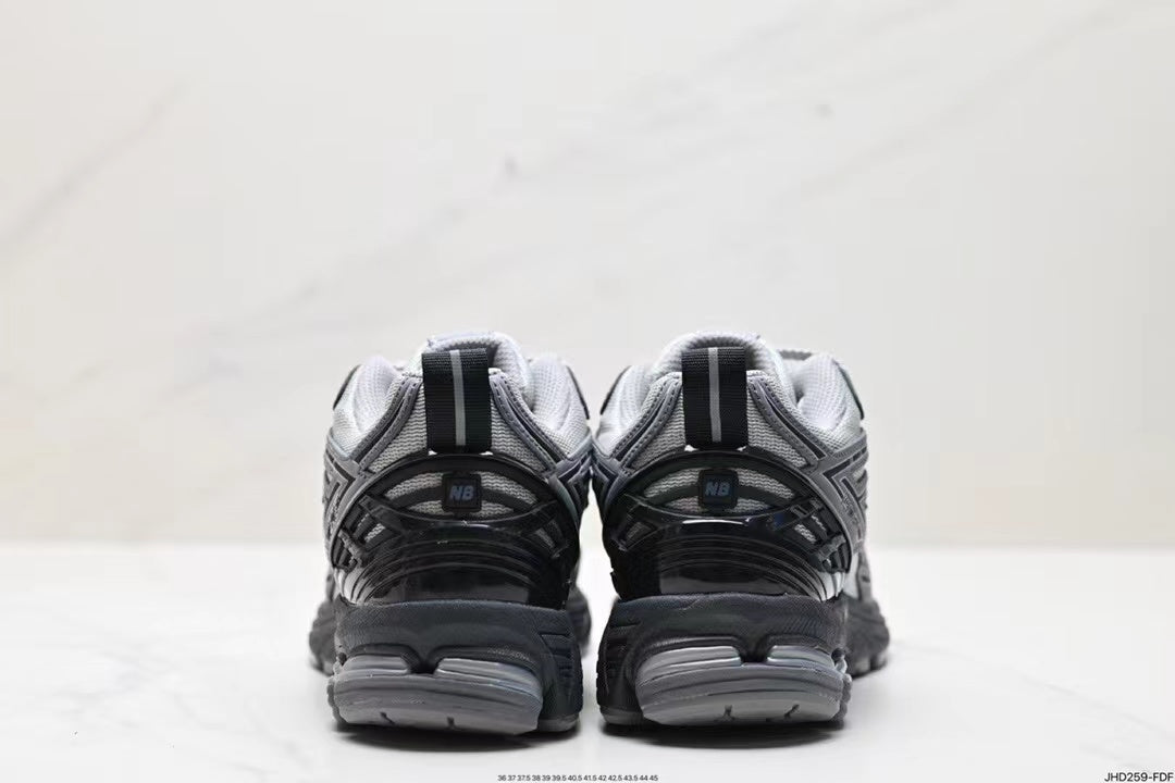 Tenis New Balance 1906 Gris Negro.