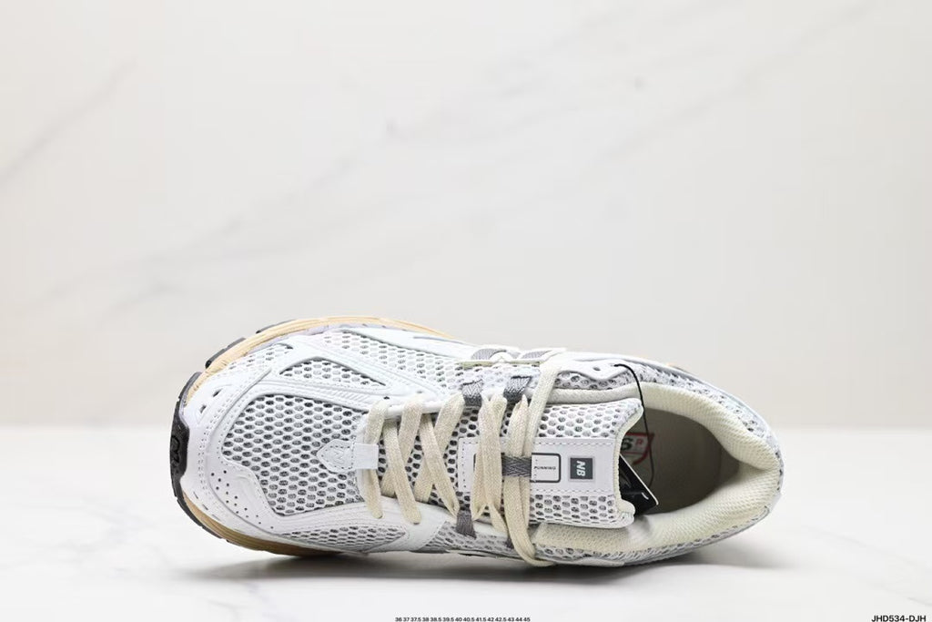 Tenis New Balance 1906 Blanco Gris.